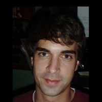 Joel Fisher Man with dark hair and eyebrows